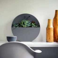 Bloem Bodye 15 In. H X 15 In. D Resin Full Moon Planter Charcoal -ORBIT || ACE || TORO Shop a15382cf a885 4260 bc0c a3e2d0d7a75d